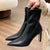 Chic black ankle boots with slim high heels, pointed toe design, perfect for autumn and winter fashion.