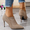 Stylish coral stiletto heels with a sleek design, ideal for parties and gatherings.