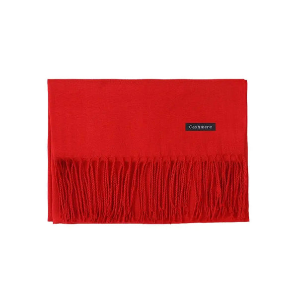 Elegant black scarf featuring tassel detailing, a winter fashion staple.