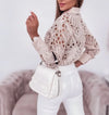 Chic women's hollowed-out long sleeve blouse in lightweight polyester, perfect for office wear or casual outings.