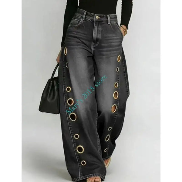 Wide leg black jeans featuring metal grommet accents and button fly closure with relaxed fit