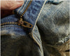 Side angle of Rebel Spirit Distressed Jeans, highlighting relaxed fit and comfort.