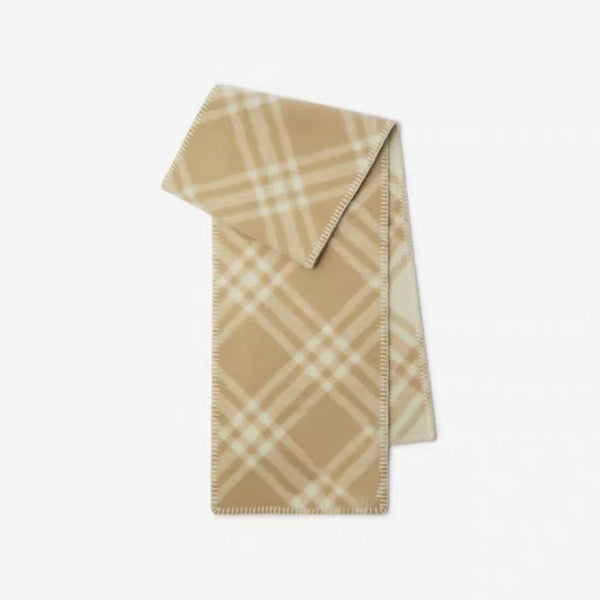 Black and white checkered scarf hanging elegantly on a coat rack.