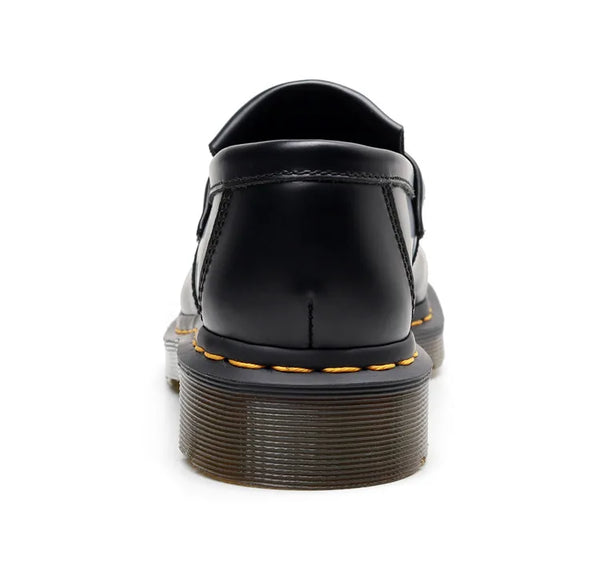 Black tassel loafers with understated elegance for evening wear.