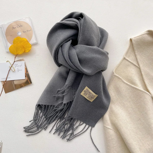 Versatile cashmere-feel scarf in classic black, ideal for any winter outfit.