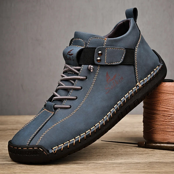 Brown leather ankle boots with lace-up closure and rubber sole