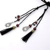 Bohemian braided faux leather skinny belt for women in camel, perfect for casual and formal outfits with fringe accents.