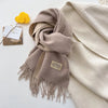 Elegant women's scarf in soft blush, perfect for adding warmth to any outfit.