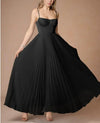 Slim-fit suspender evening dress with elegant high-waist and textured pleating throughout