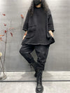 Functional long-sleeve top with pockets, ideal for relaxed gatherings.