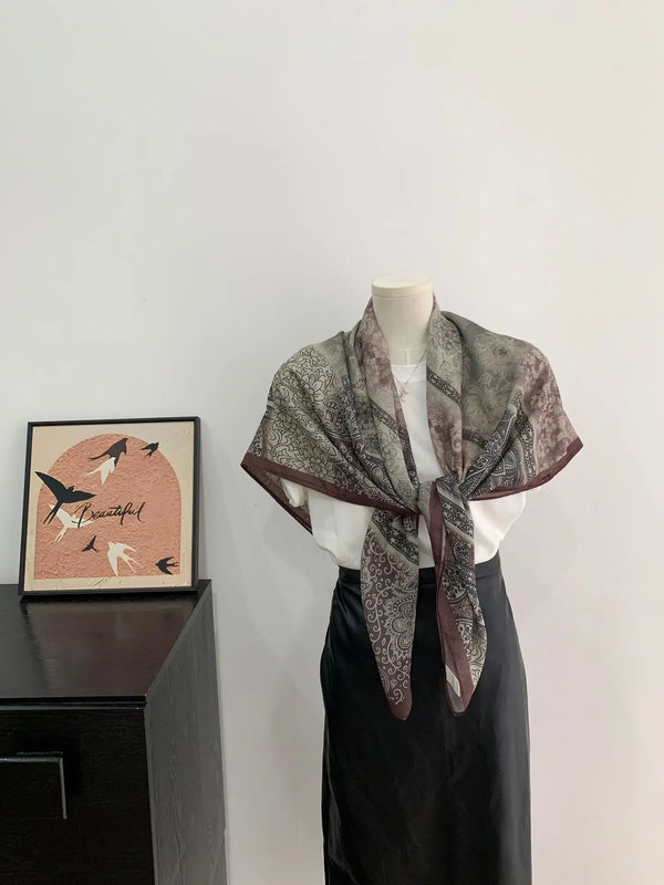 Soft polyester scarf with a stylish vintage pattern, perfect for casual wear.