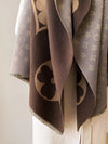Geometric pattern detail of the cozy Winter Whispers shawl in soft tones.