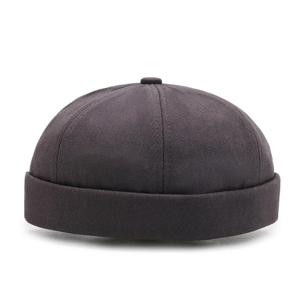 Black docker cap on model showing comfortable secure fit