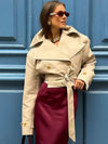 Timeless double-breasted trench coat featuring turn-down collar and belt