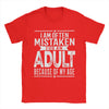 Men's humorous "Mistaken For An Adult" cotton tee, breathable fabric, relaxed fit, perfect for casual wear and gifts.