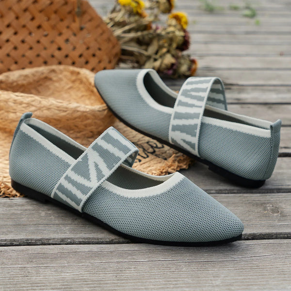 Knitted flats showing elastic band closure and durable rubber outsole for all-day comfort