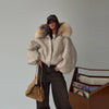 Close-up of irresistible plush texture on oversized hooded jacket