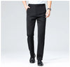 Wrinkle-free suit pants featuring elastic waistband and breathable fabric