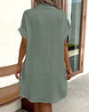 Side view of mini dress highlighting functional pocket detail and flattering regular fit