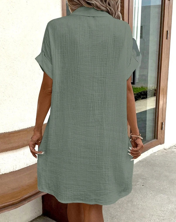 Side view of mini dress highlighting functional pocket detail and flattering regular fit
