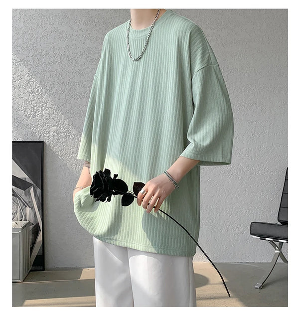 Unisex striped summer tee in vibrant hues, perfect for adding flair to summer wardrobes.