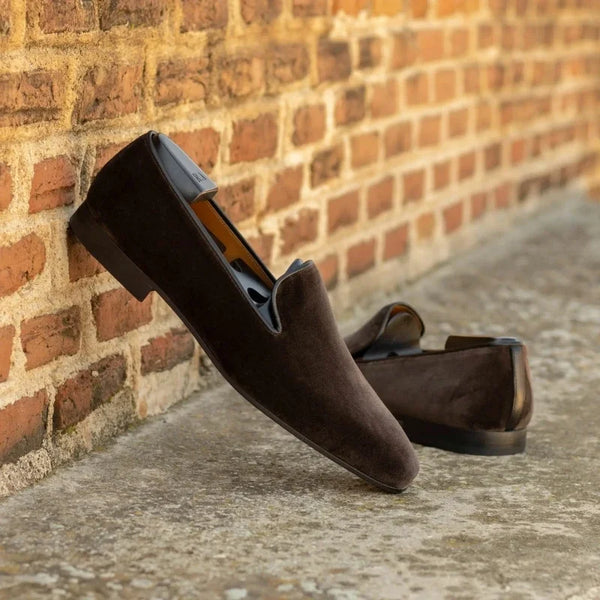 Durable rubber outsole on red bottom loafers for men.