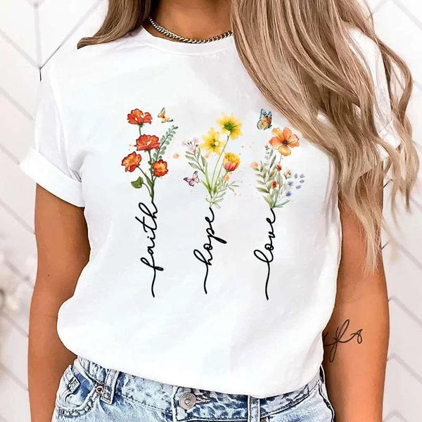 Floral print women's tee featuring 'Faith Hope Love' message, perfect for casual wear and versatile styling options.