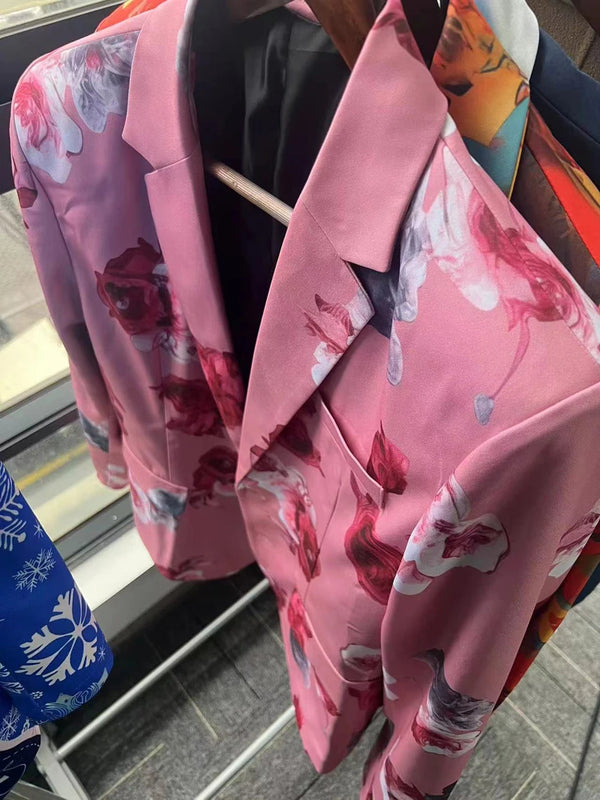 Model wearing Midnight Bloom Suit, exuding confidence with striking floral print.