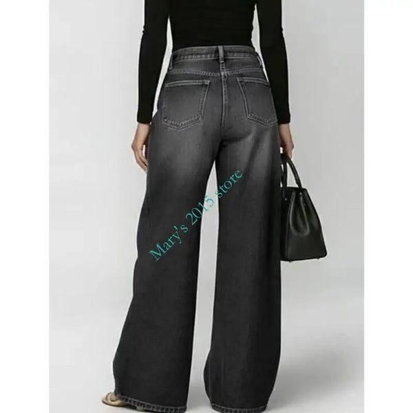 High waisted wide leg jeans with retro wash finish and edgy metal hardware details