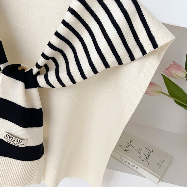 Fashionable lightweight scarf with classic stripes for autumn style.