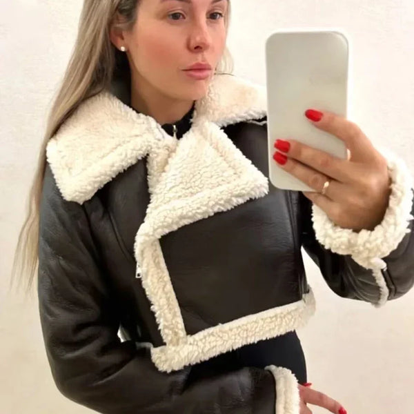 Chic cropped leather and wool blend jacket for women with fur trim, zipper closure, and stylish turn-down collar.