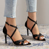 Elegant burgundy stiletto sandals featuring a durable rubber outsole.