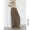 Comfortable high-waisted pleated trousers featuring graceful wide leg design and adjustable closure