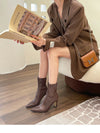 Chic black ankle boots with slim high heels, pointed toe design, perfect for autumn and winter fashion.