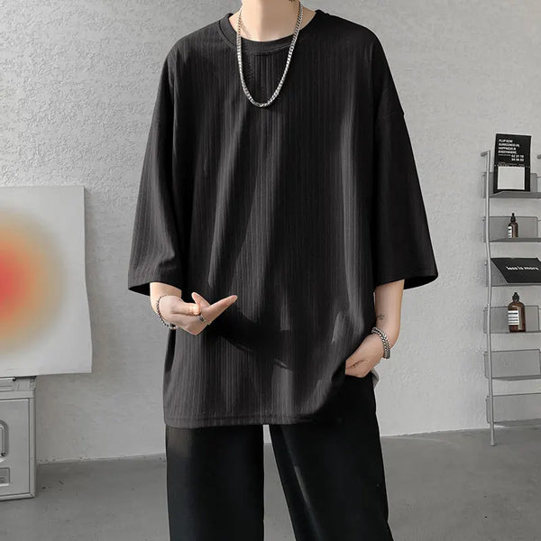 Model wearing striped summer tee, demonstrating its relaxed fit for all body types.