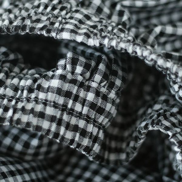 Chic plaid wide-leg pants in cotton-linen blend, featuring a high waist, pockets, and elastic waistband for comfort and style