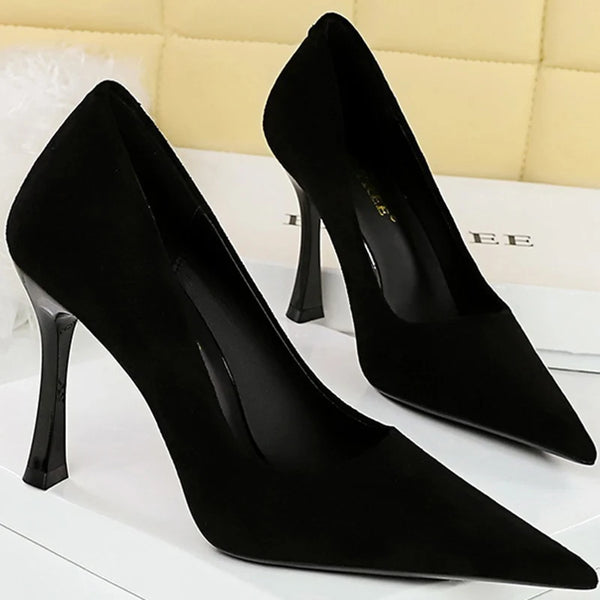 Classic black slip-on stilettos featuring thin high heels.