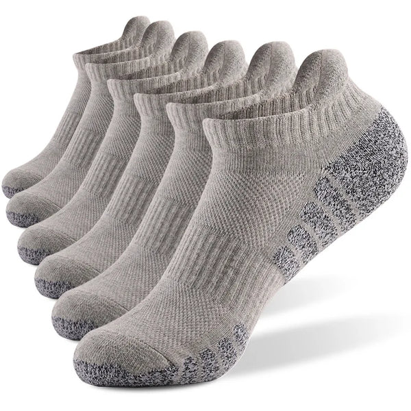 Moisture-wicking sports socks in white, designed to repel sweat and keep feet dry.