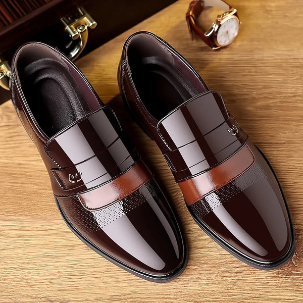Close-up of brogue detailing on elegant black leather Oxford shoes.