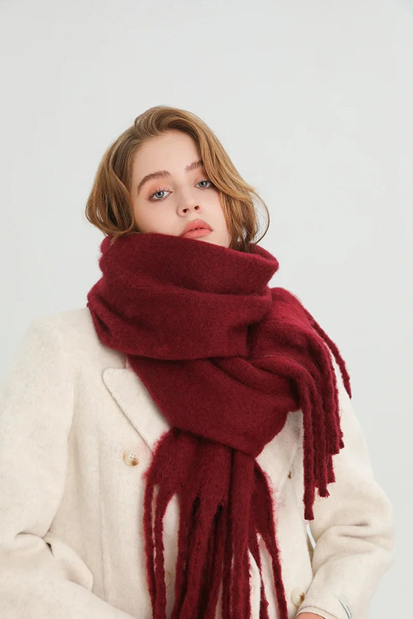 Thick winter scarf in cream color, perfect for chilly days.