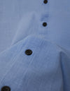 Single-breasted cotton shirt with short sleeves paired with coordinating shorts