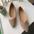 Close-up texture shot of breathable knit construction on ballet flat upper