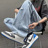 Men's black denim jeans with a modern hip hop influence and relaxed fit.