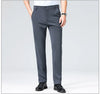 Navy dress pants with high drape fabric photographed against neutral background showing elegant flow