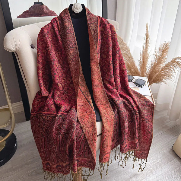 Versatile pashmina scarf styled as a head wrap with tassel accents.