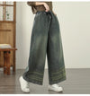 Vintage embroidered wide-leg jeans for women, featuring elastic waist and ethnic-inspired design, perfect for autumn fashion.