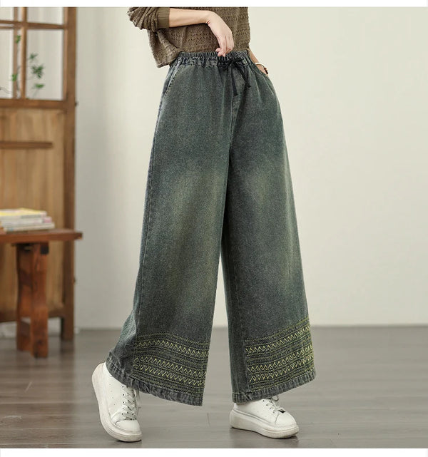 Vintage embroidered wide-leg jeans for women, featuring elastic waist and ethnic-inspired design, perfect for autumn fashion.