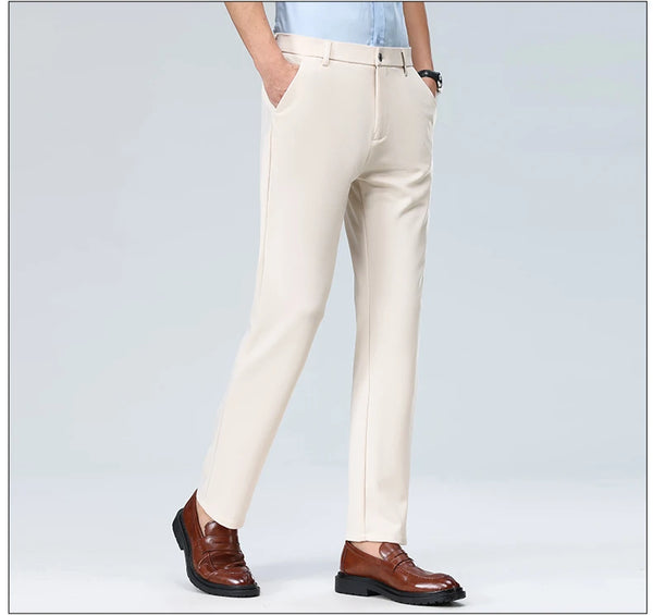 Navy blue dress pants styled smart-casual with sneakers for versatile professional look