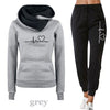 Comfy Autumn Women's Tracksuit: Hoodie & Black Pants Set, Street Style Chic, Comfortable Polyester Blend.
