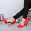 Chic bow-accented leather stiletto shoes for women - sophisticated and elegant high heels with pointed toe design.